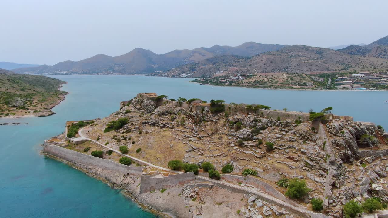 aerial view of ruins and fortress walls on hill of Island Spinalonga (Kalydon)