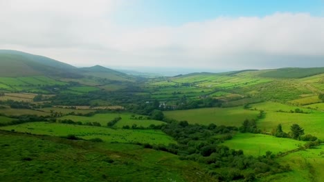 green patchwork fields on the hills 4k