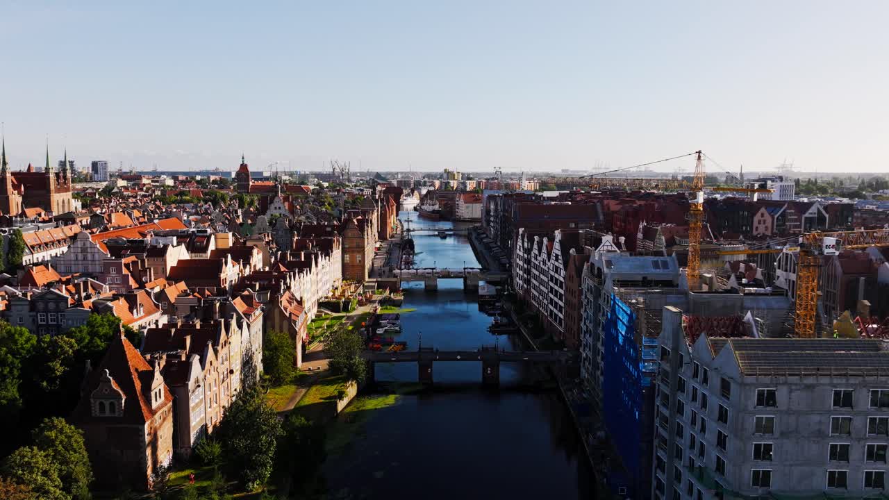 Cinematic drone movement reveals Gdansk Motlawa River, Old Town and city harbor