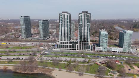 aerial push-in of mirabella towers, shore and road traffic in toronto