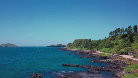 beautiful coastline with fishing boats in jeju, south korea