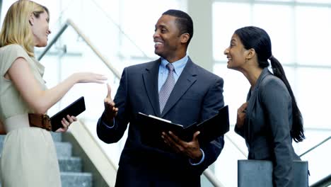 multi ethnic business people meeting together in office