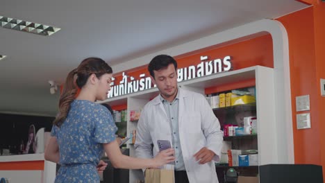 man cashier scanning a barcode at a smartphone for contactless payment. digital wallet