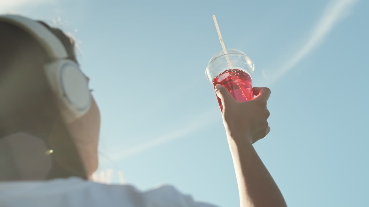 Looking at Sky Through Soda Cup