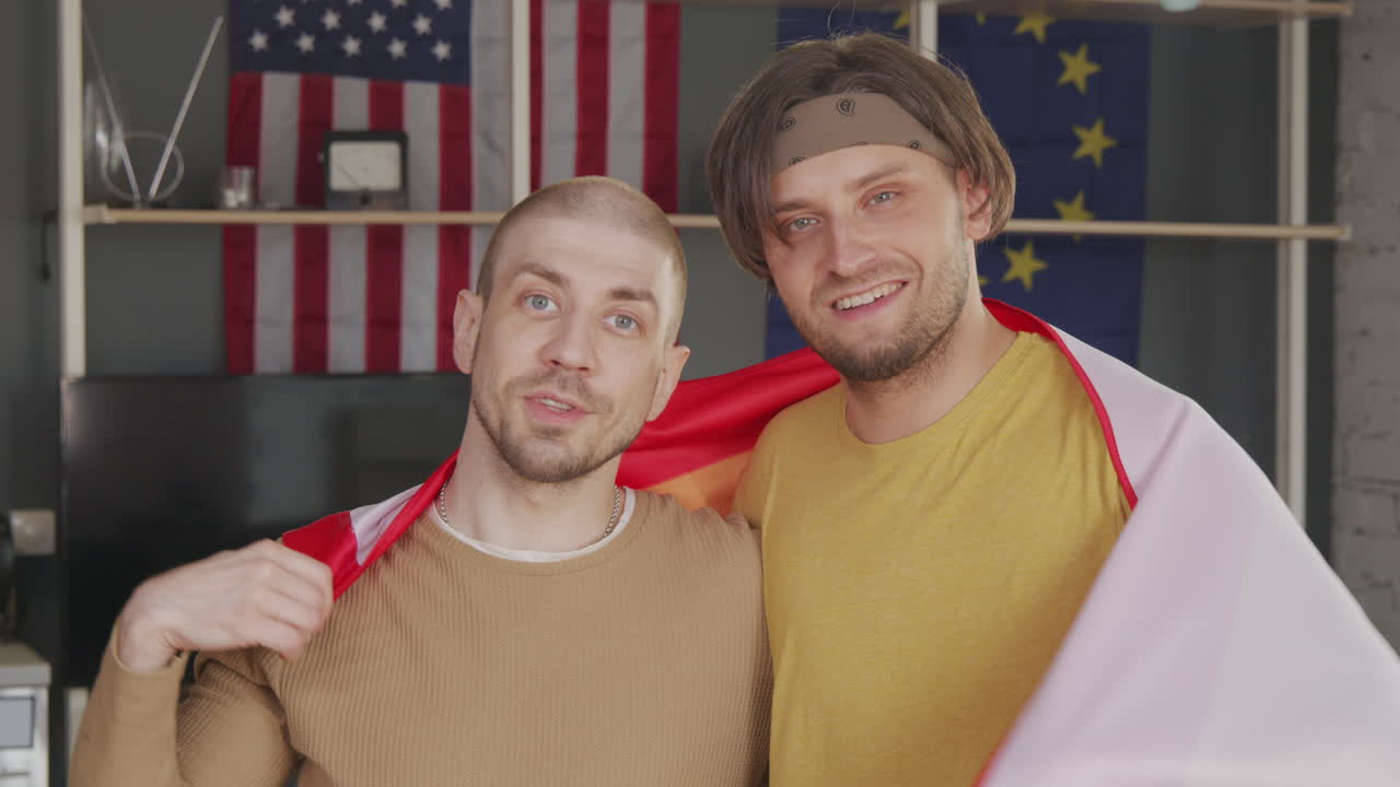 Gay Men with Rainbow Flag Posing for Camera