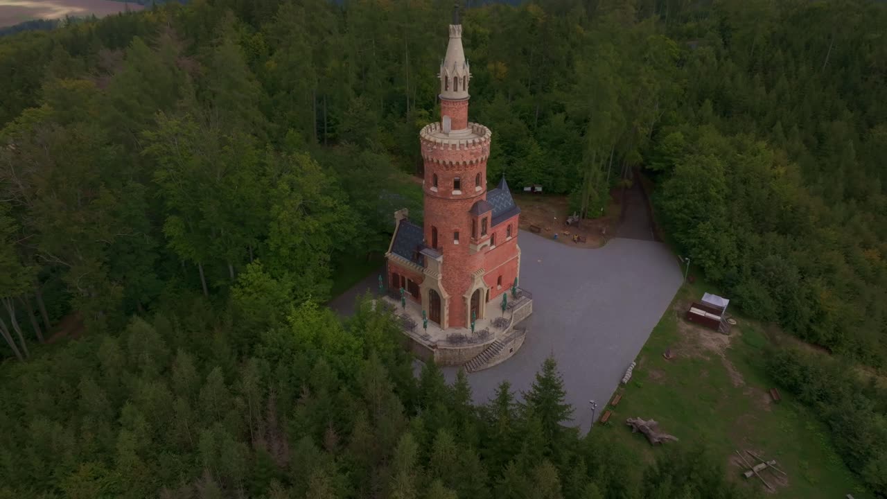 Aerial shot of Goethe's tower surrounded by forest in Karlovy Vary, Czech