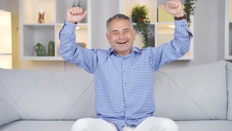 man experiencing joy looking at camera.