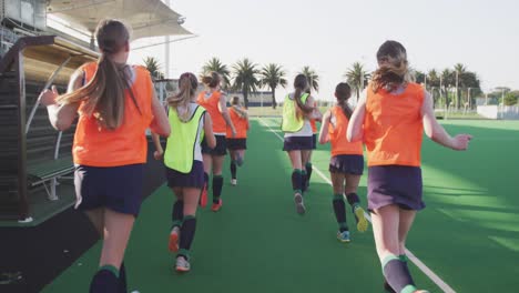 Female-hockey-players-warming-up-in-stands