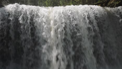 Water-cascading-over-a-waterfall-in-Owen-Sound,-Canada,-creating-a-powerful-and-serene-scene