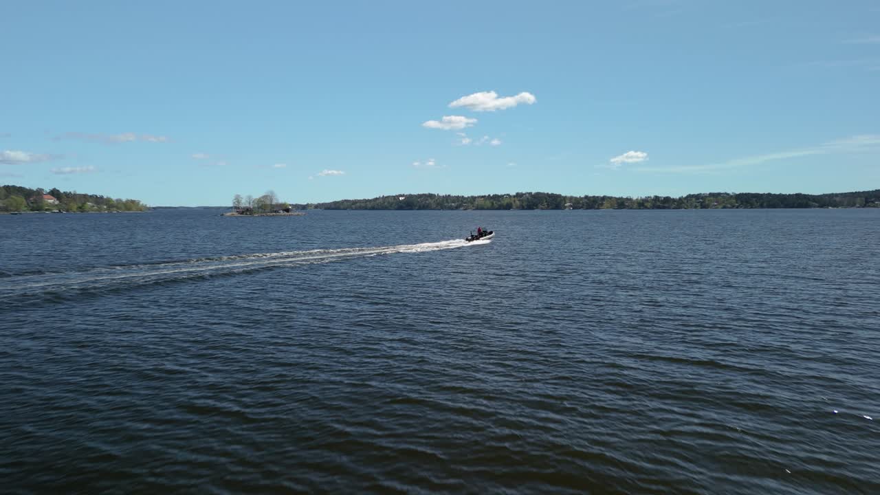 Aerial shot following a speed boat.