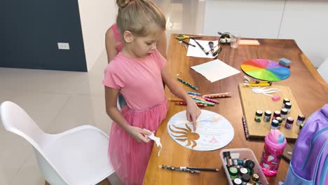 mother and daughter doing arts and crafts together