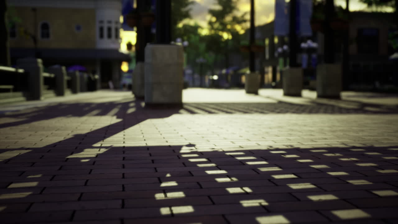 Sunset shadows dance across the cobblestone pathways of a bustling plaza