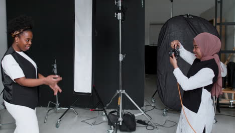 photographer taking pictures in studio