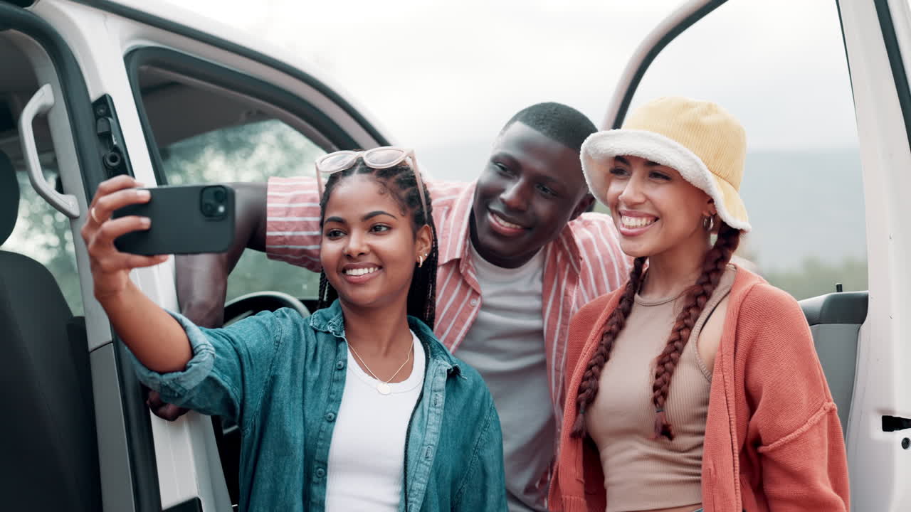 Friends taking a selfie during a road trip