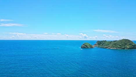 vila franca islet in são miguel, with clear blue sky and ocean, aerial view