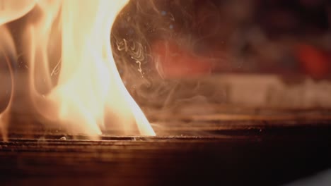 a steak cooks on a grill