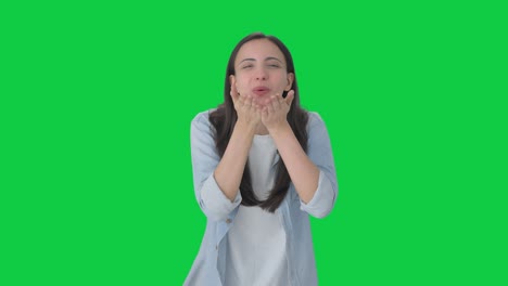 Happy-Indian-girl-giving-flying-kisses-Green-screen