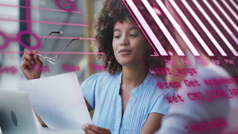 Animation-of-graphs,-globe-and-computer-language-over-diverse-female-coworkers-discussing-reports