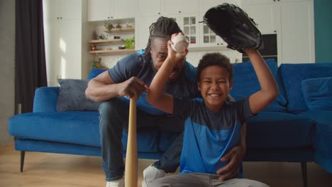 excited family baseball fans watching baseball on tv and celebrating victory