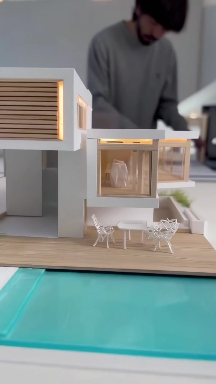 Modello architettonico di una casa di lusso moderna con piscina