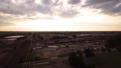 Aerial-of-railroad-yard-at-sunset