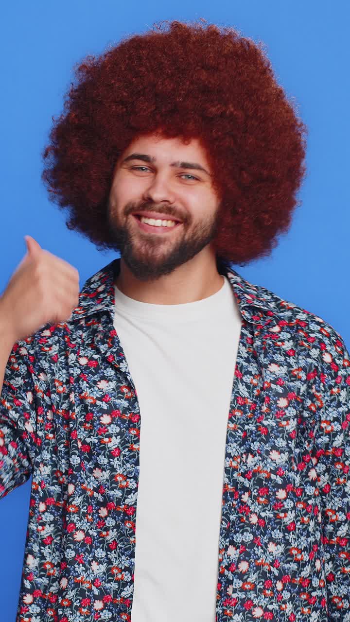 Caucasian man pointing down saying to subscribe gesturing ok like showing place for information