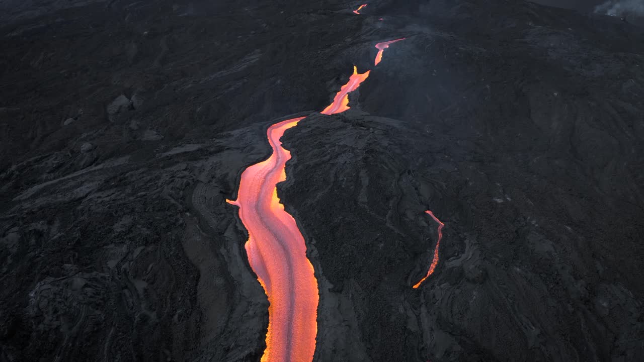 drone flying backwards and revealing huge lava stream from the Cumbre vieja volcano in La Palma