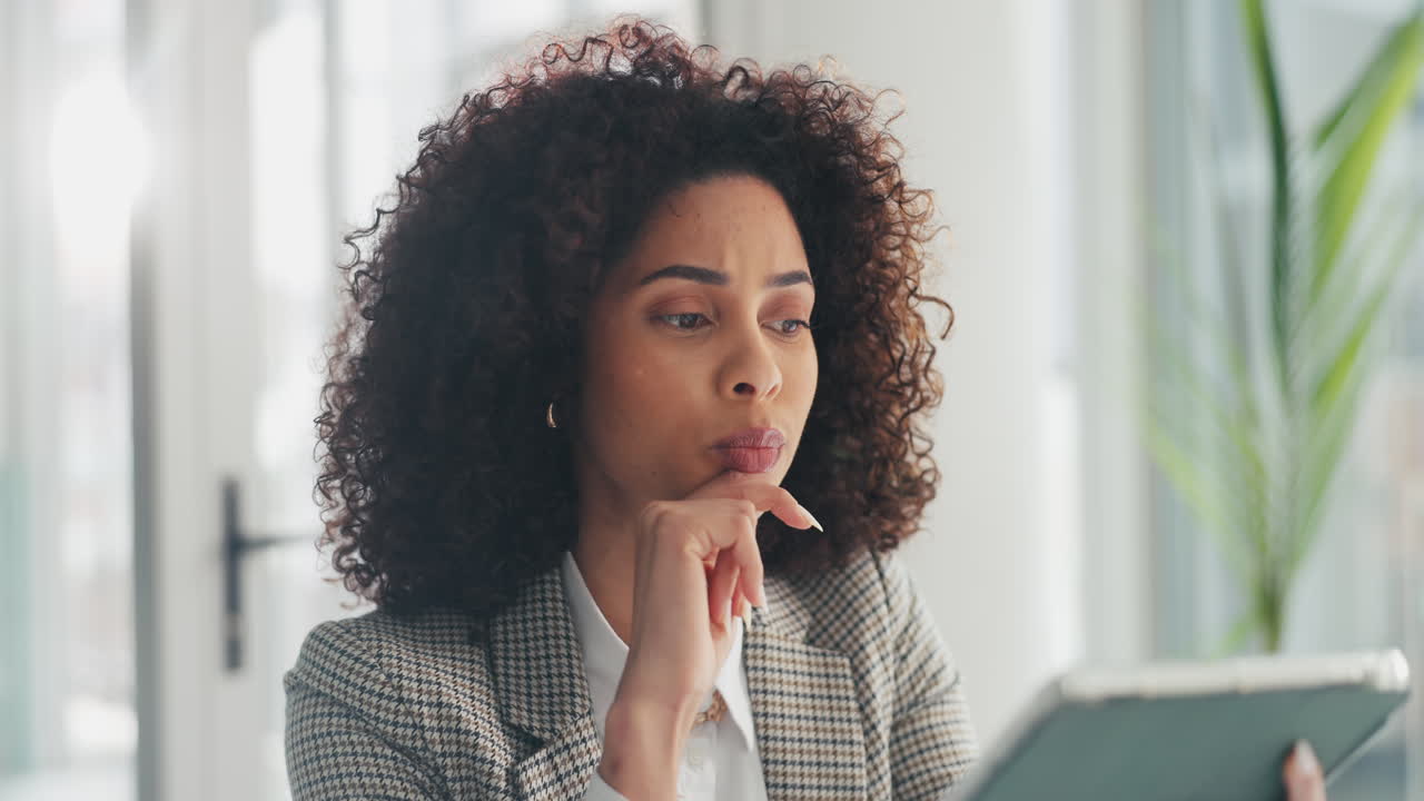 Thoughtful businesswoman working in office