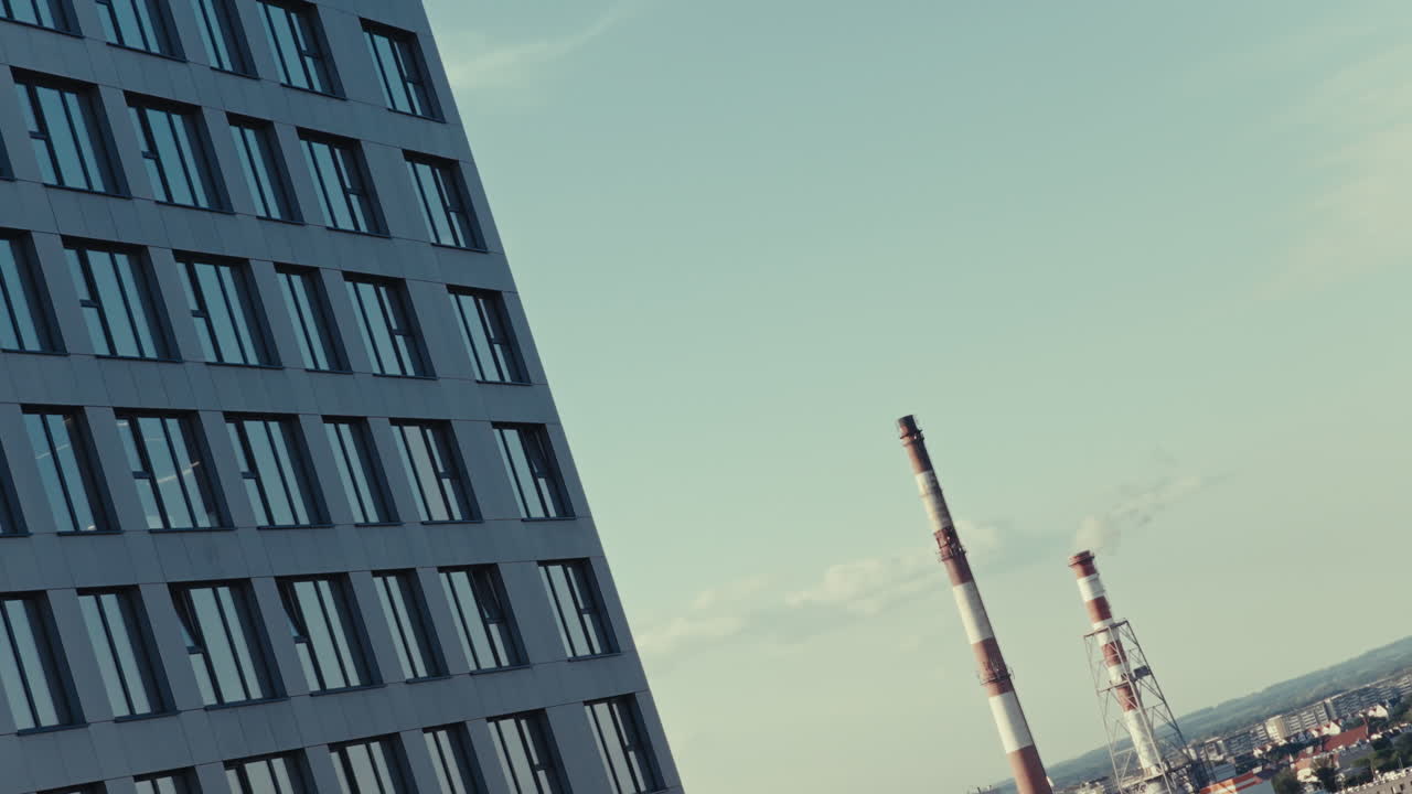 Modern Building with Industrial Chimney