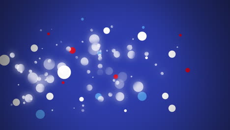 animation of spots in red, white and blue of flag of united states of america over blue background