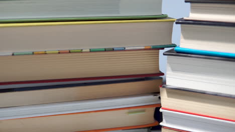 Two-stacks-of-books-side-by-side,-close-up