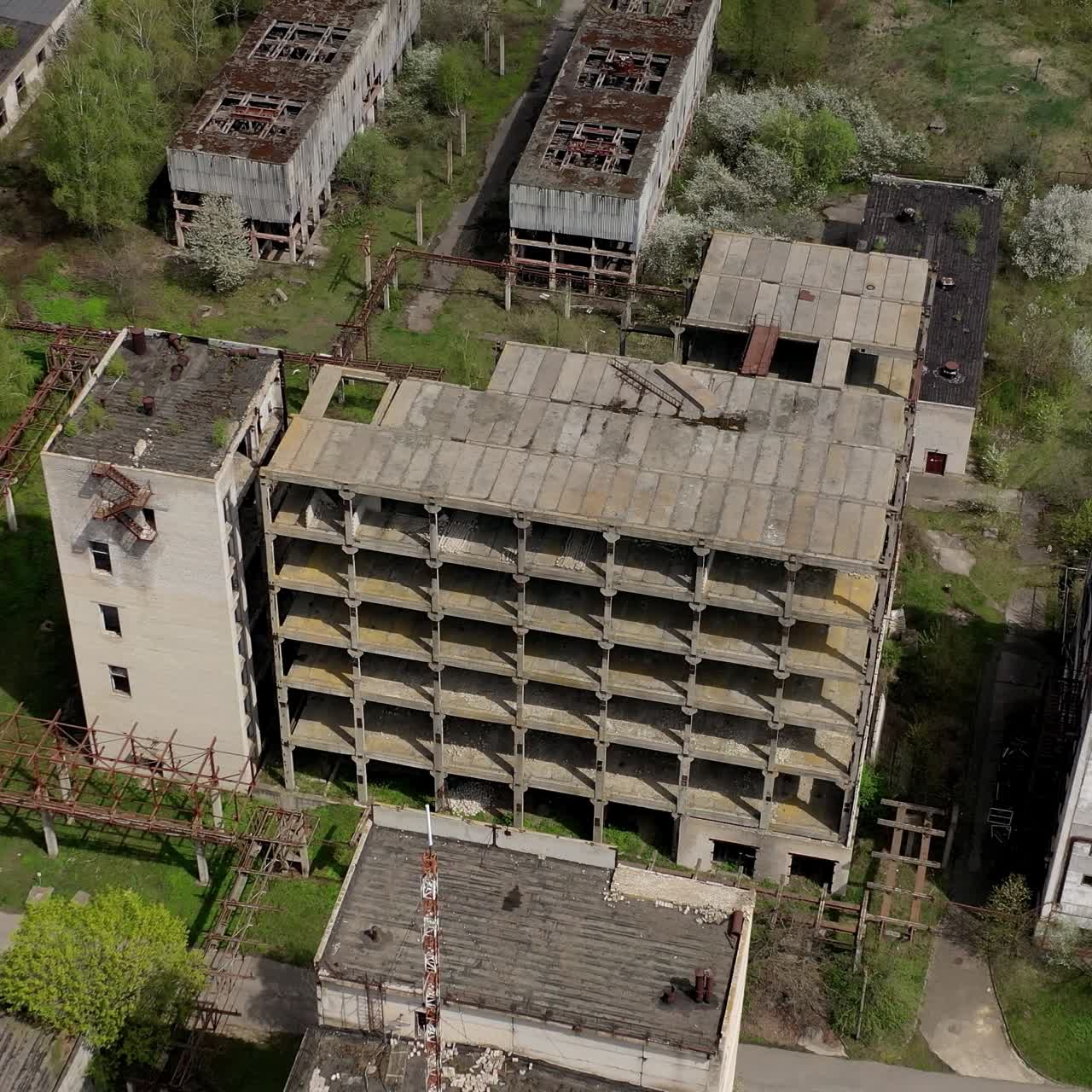Aerial view of ruined old factory. Aerial shot of big abandoned factory