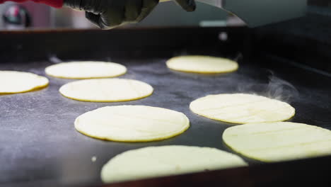 flipping taco shells on the griddle - food truck series