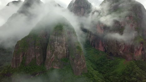 misty-cloudy aerial drone shot of amboro national park, bolivia