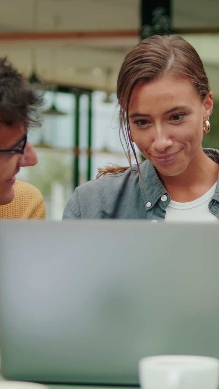 Close up of male and female students, European boys and a girl using modern