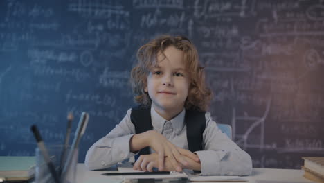 smiling boy student in classroom