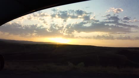 Slow-Motion:Reflection-side-rear-view-car-mirror-in-the-morning-on-the-road-at-sunset-or-sunrise