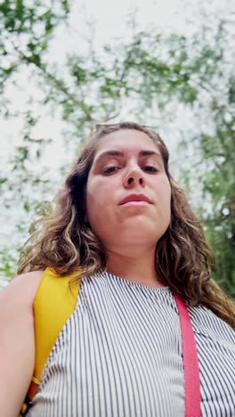powerful low angle portrait of a young woman looking forward