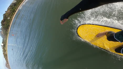 pov of a surfer surfing on ocean wave