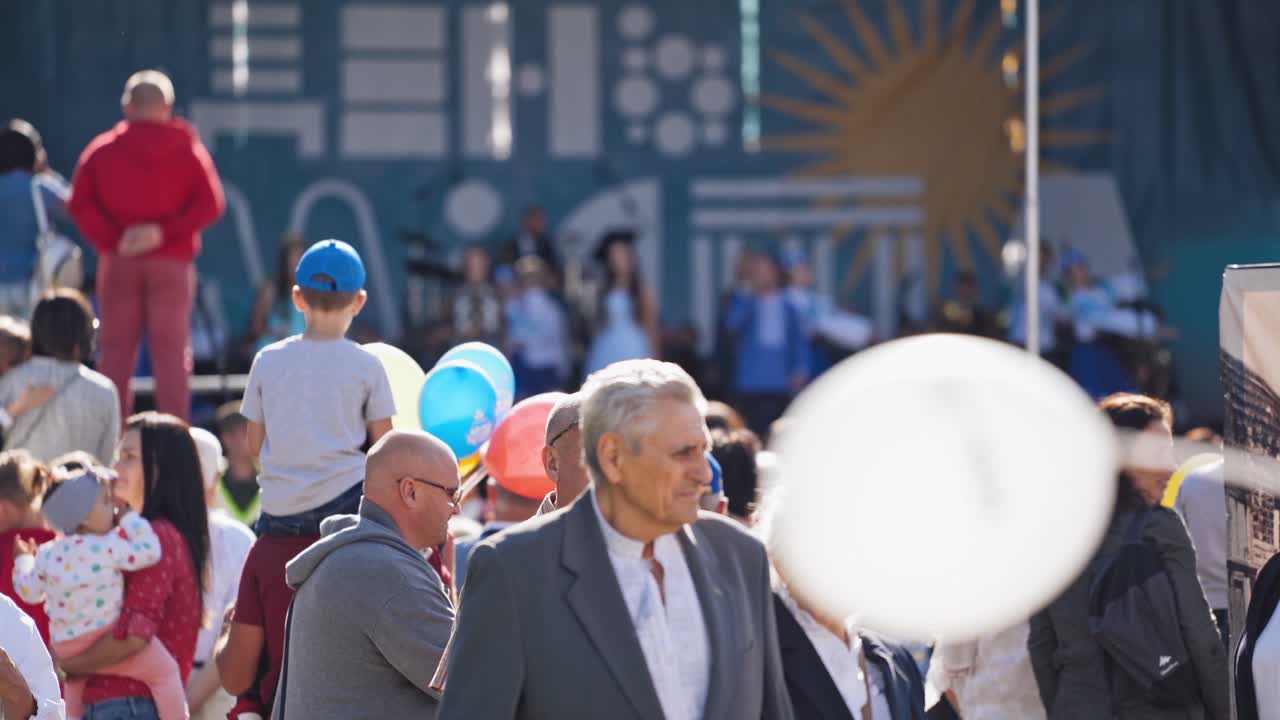 City festival on street. People relaxing and having fun on the outdoors event