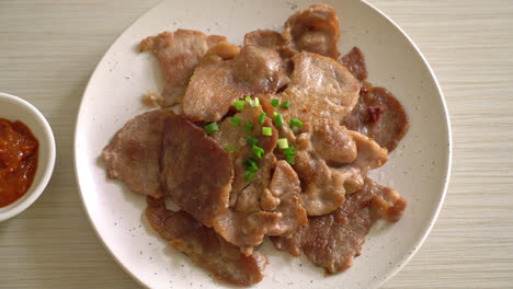 grilled-pork-neck-sliced-on-plate-in-Asian-style