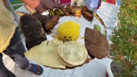 closeup outdoor shot of bengali traditional food with fish, rice