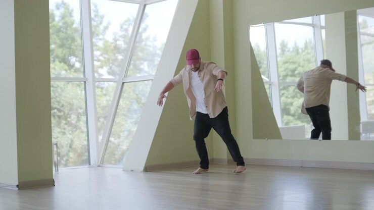 Man Breakdancing in Modern Studio