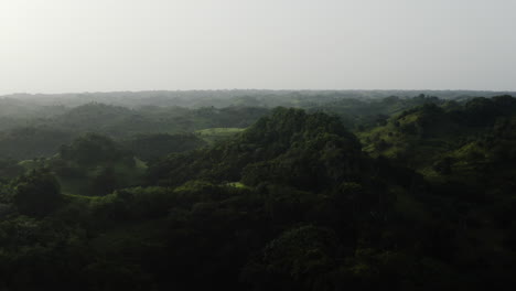 Hills-and-Forests-seen-from-above-in-Los-Haitises-National-Park,-Dominican-Republic---aerial-drone-shot