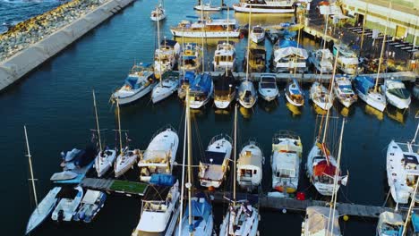 4k drone fly over the harbor with boats docking