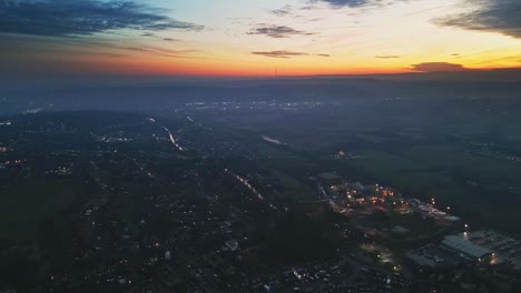 cinematic aerial drone sunset night vertical view of city street traffic, buildings, england, uk