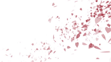 lots of small pink hearts falling across a white background