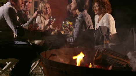 mature friends enjoying outdoor evening meal shot on r3d