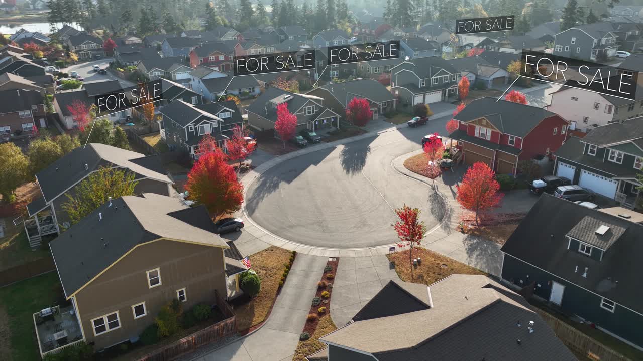 Aerial view of a neighborhood during autumn with &amp;quot;FOR SALE&amp;quot; signs animating over the homes