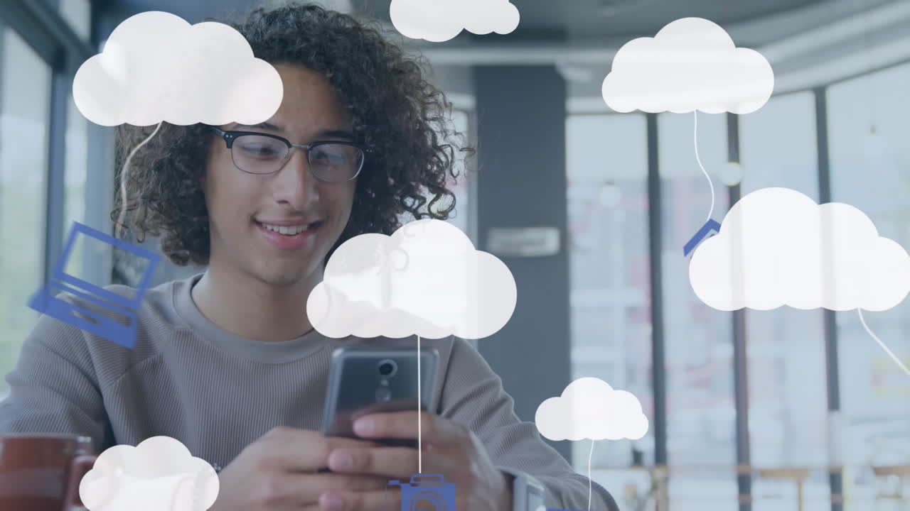 Animation of clouds and digital icons over man using smartphone